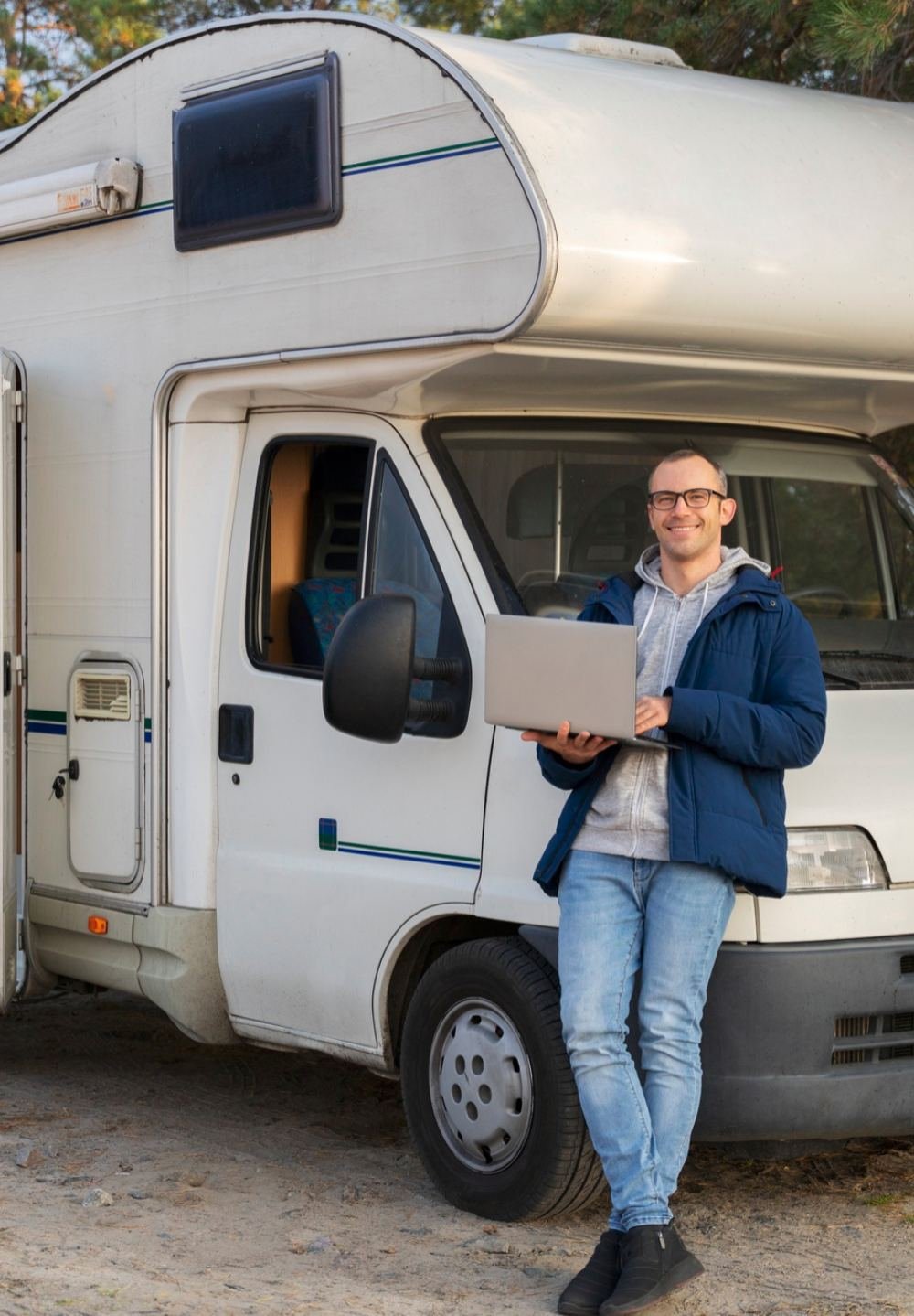 man standing infront of camp van